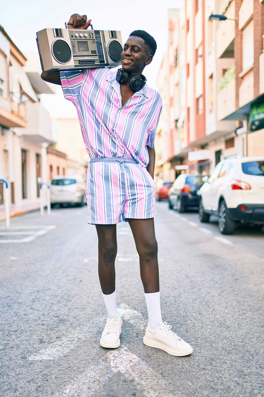 cool 90s guy holding a boombox