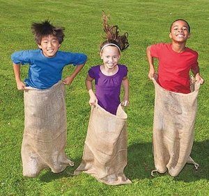 Kids having a potato sack race