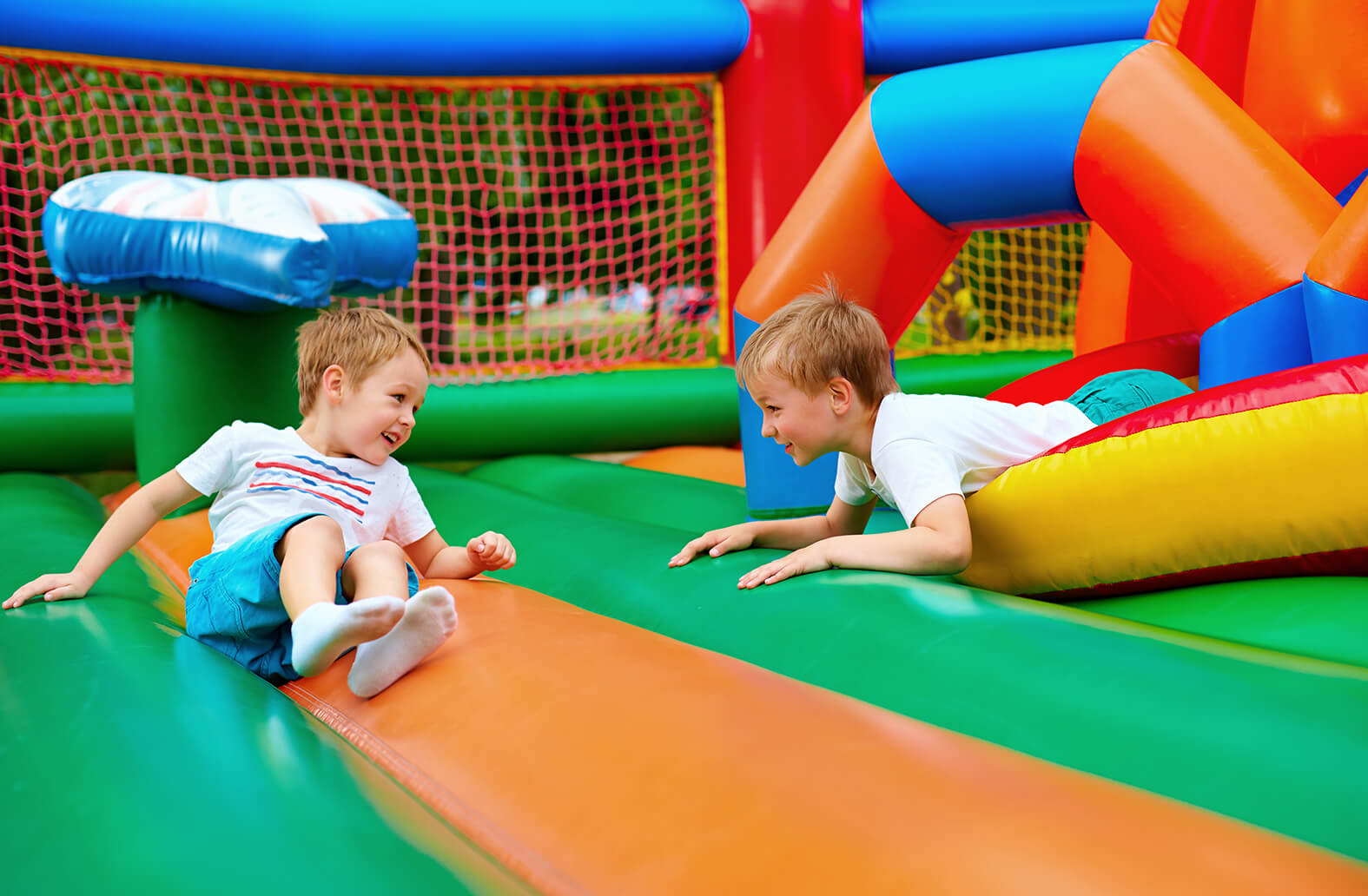 Children playing in bounce house rental
