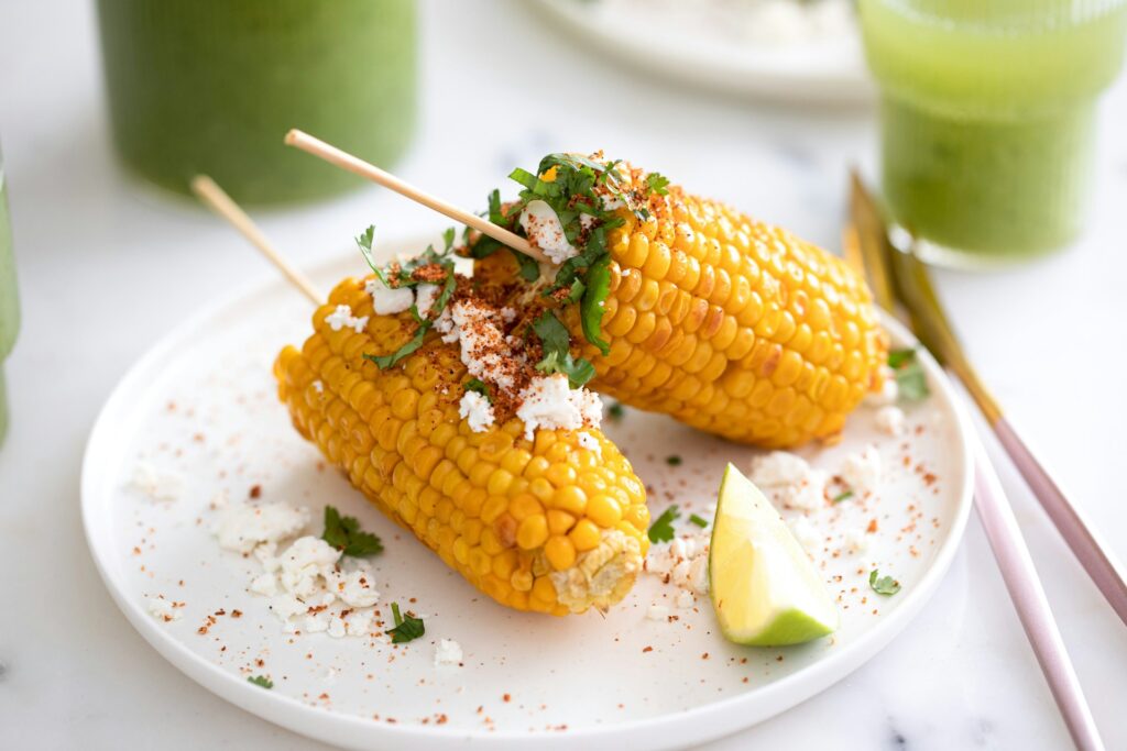 grilled corn with a cheese topping