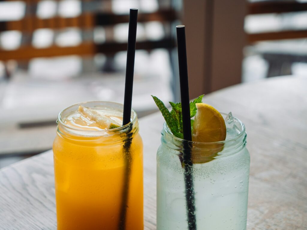 fresh squeeze lemonade in a glass jar with a straw